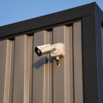 security camera on grey metal building